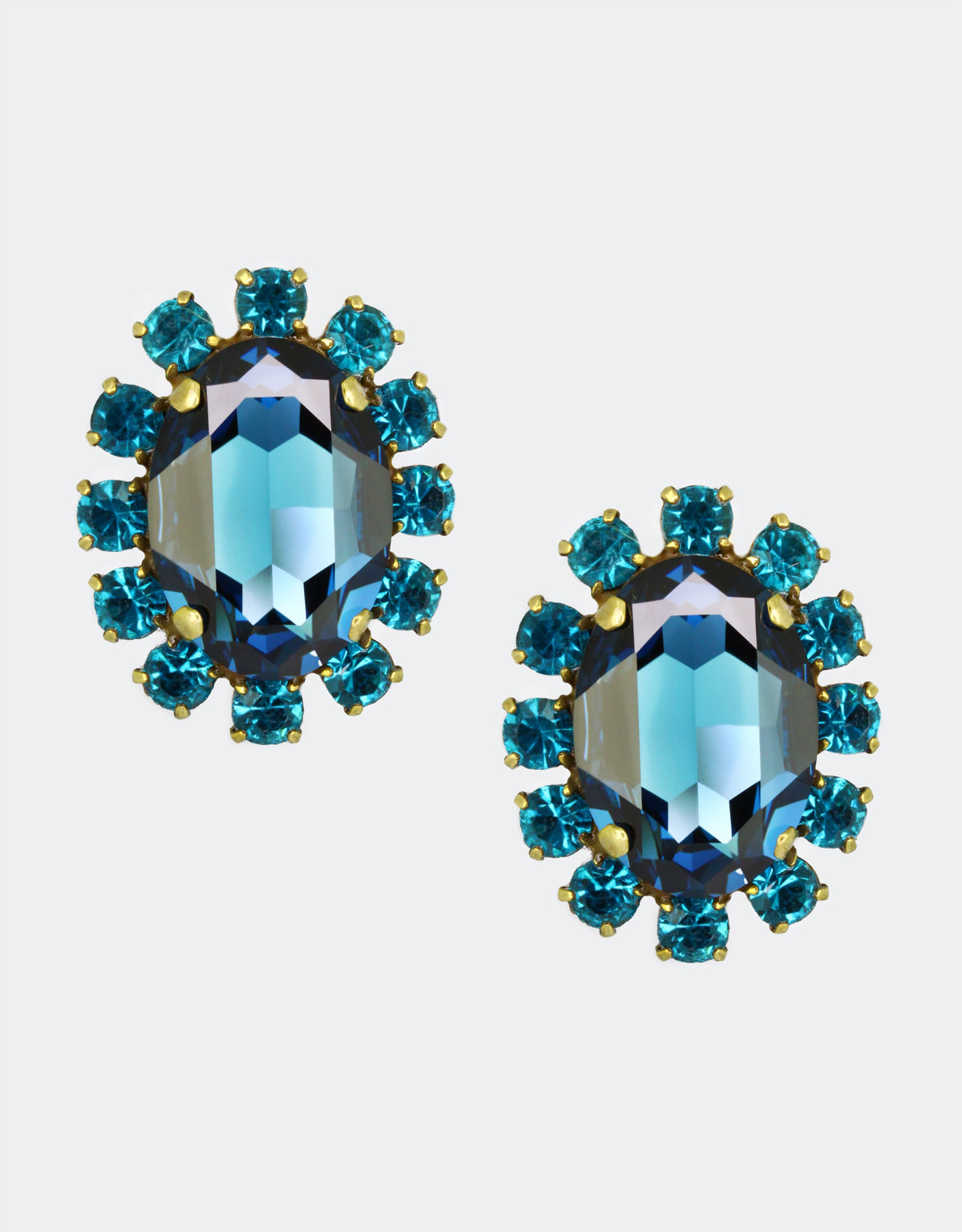 blue crystal earrings in halo design a fine choice for cocktail events and high end society meetups
