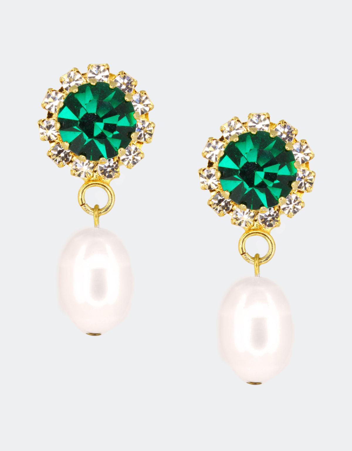 A pair of earrings featuring a green crystal top with a gold-colored setting, connected by a gold-tone post to a white pearl drop.