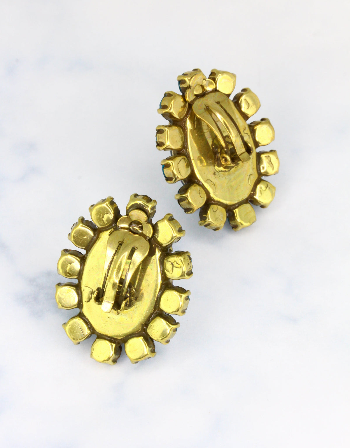 golden crystal earrings in oval stud design