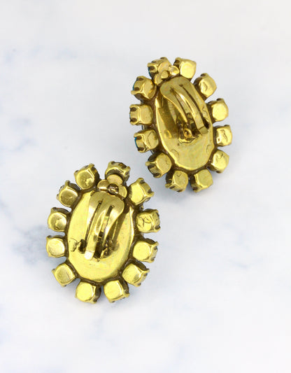 golden crystal earrings in oval stud design