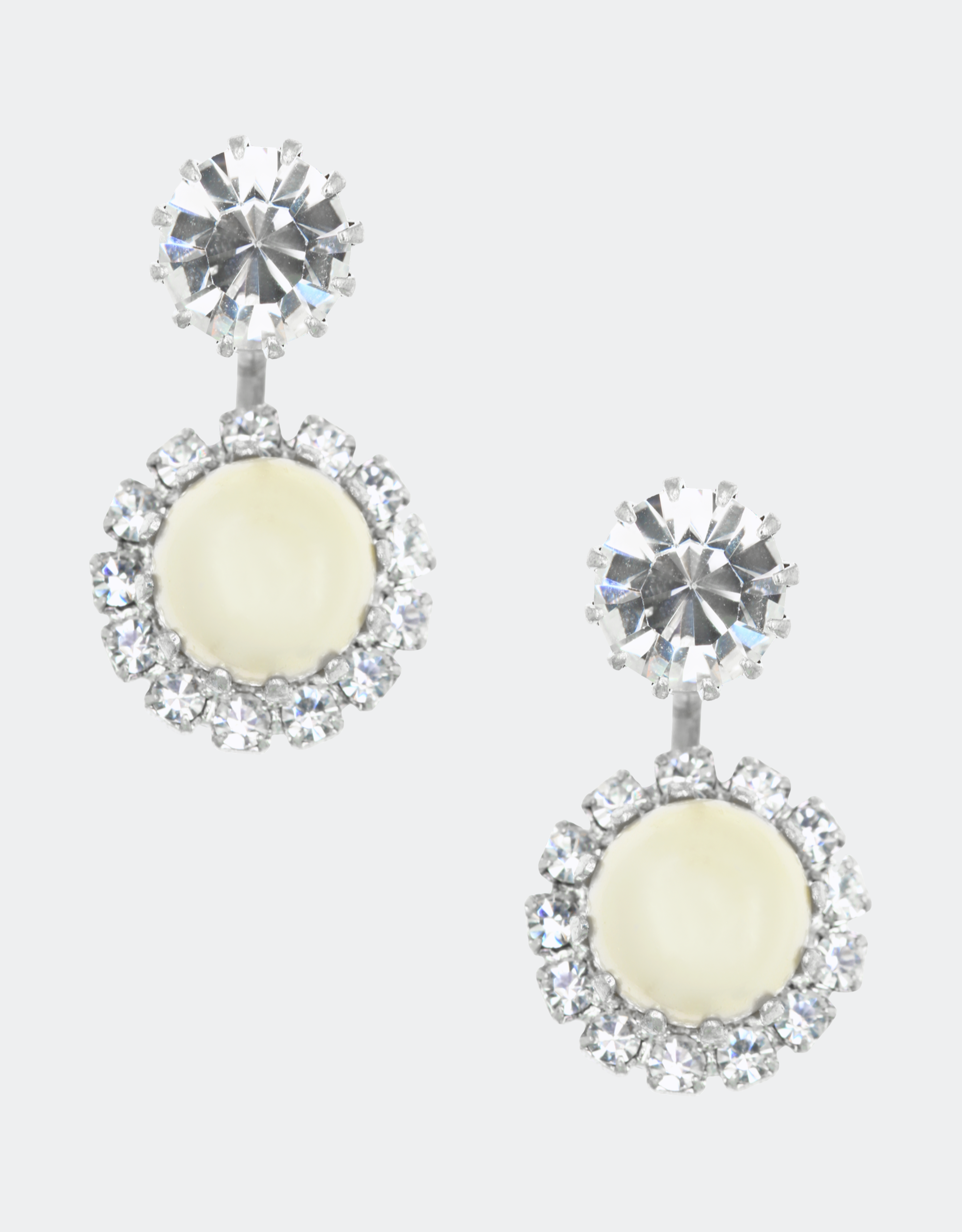 A pair of jacket earrings featuring a central crystal stud surrounded by smaller crystals arranged in a circular pattern, all in silver color.