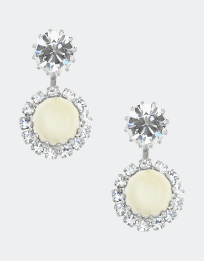 A pair of jacket earrings featuring a central crystal stud surrounded by smaller crystals arranged in a circular pattern, all in silver color.