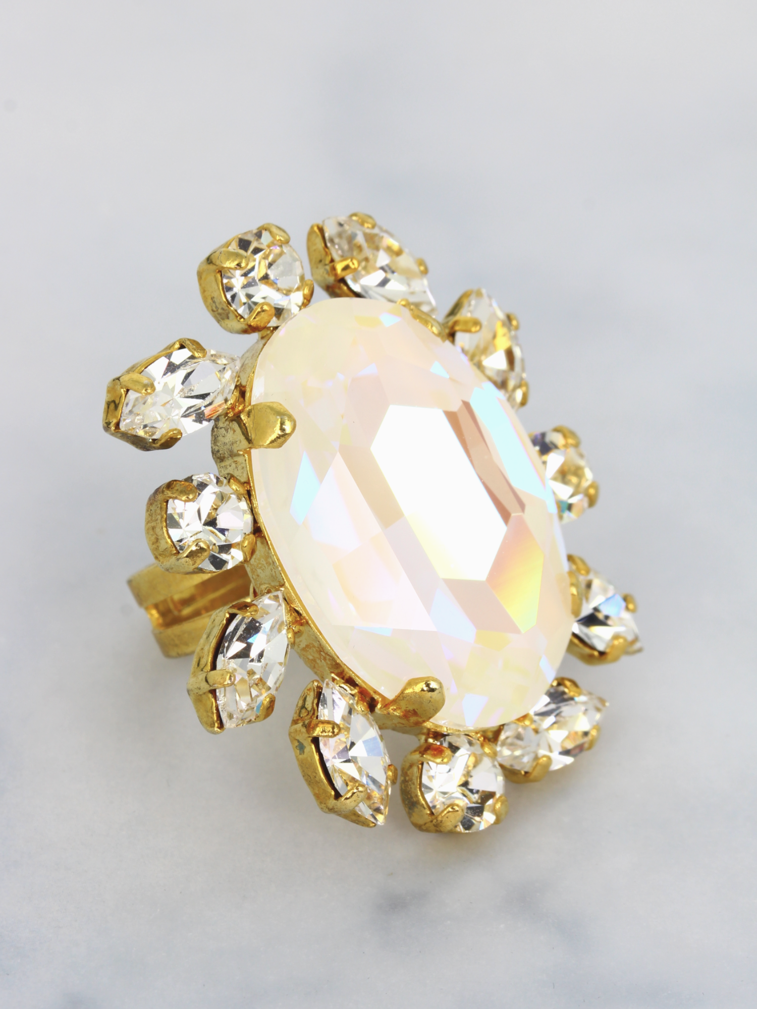 pink crystal ring with golden band and small crystal on sides perfect for evening soiree, cocktail parties and gala dinners.