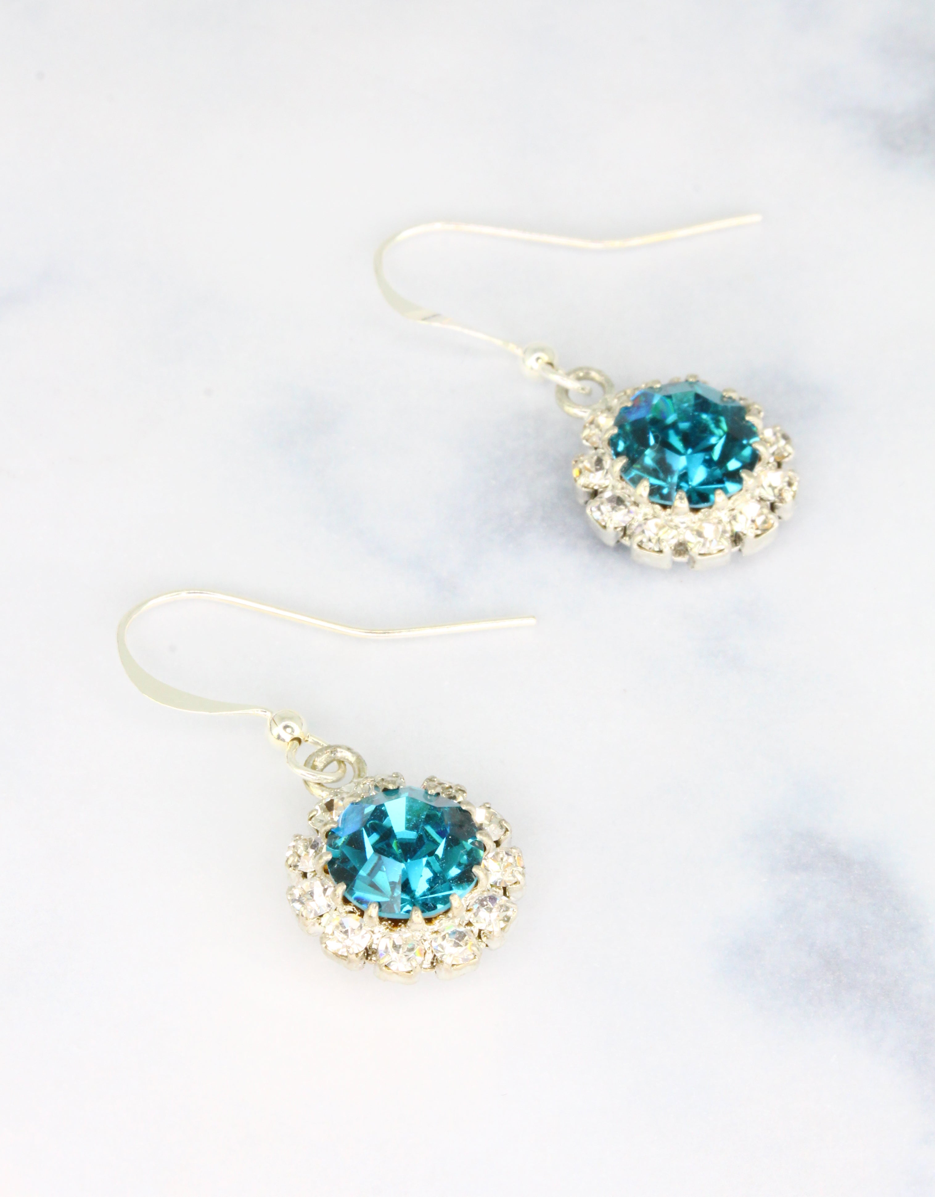 Selene Crystal June Hanging Rosetta drop earrings in ruby red crystal with gold hook – rich handcrafted colour earrings with bold sparkle for parties and special occasions.

