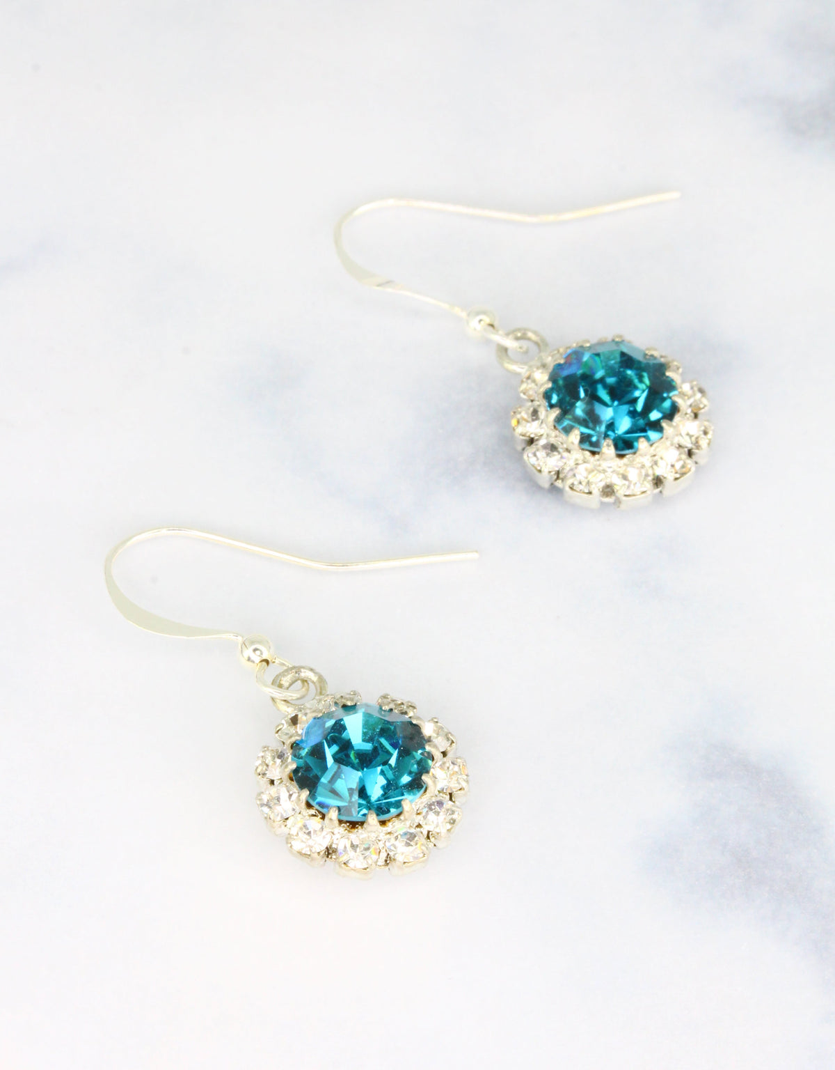 Selene Crystal June Hanging Rosetta drop earrings in ruby red crystal with gold hook – rich handcrafted colour earrings with bold sparkle for parties and special occasions.

