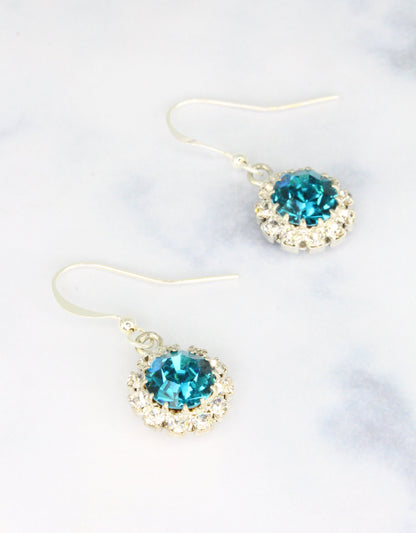 Selene Crystal June Hanging Rosetta drop earrings in ruby red crystal with gold hook – rich handcrafted colour earrings with bold sparkle for parties and special occasions.

