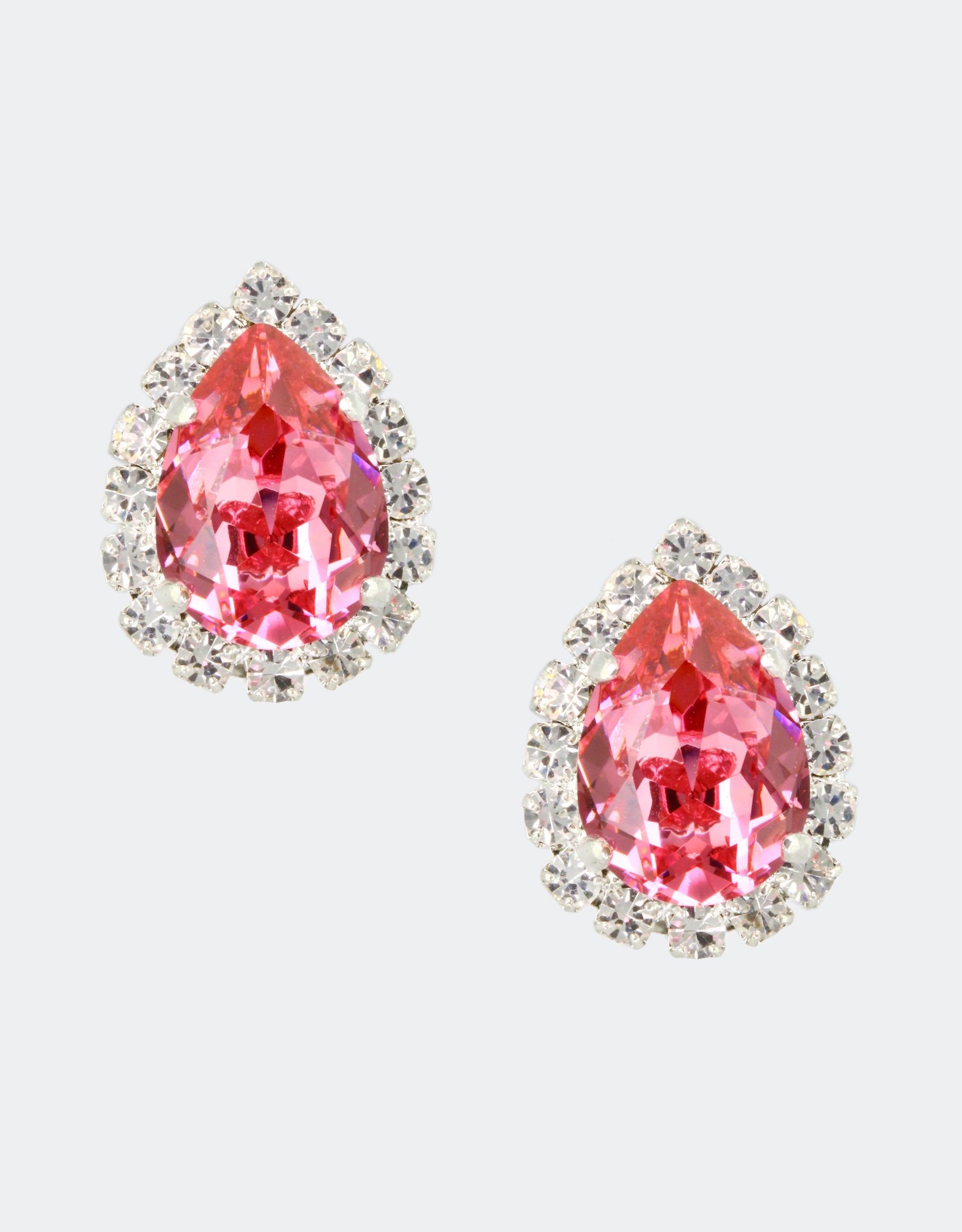 Selene Crystal Lily Pear Rosetta stud earrings in blush pink crystal with halo setting – fine crystals surrounding a gorgeous pear-shaped centre, perfect for everyday wear and special occasions. Free worldwide shipping on orders over £199.