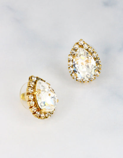 Selene Crystal Lily Pear Rosetta studs in clear crystal with silver halo – classic pear-shaped stud earrings with pure brilliant sparkle, a true jewellery box essential. Free worldwide shipping on orders over £199.