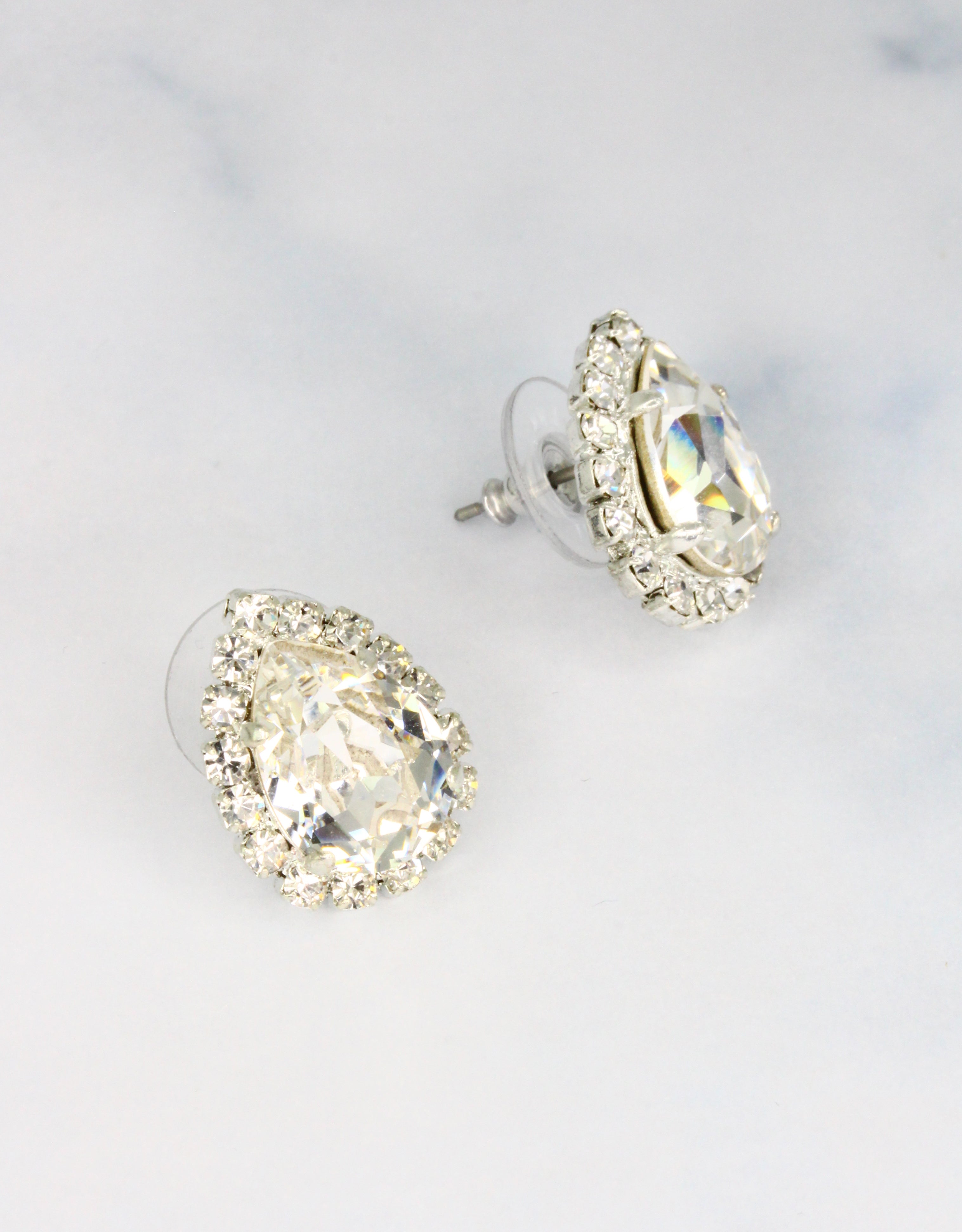Selene Crystal Lily Pear Rosetta studs in crystal white with silver halo – rich jewel-toned pear-shaped stud earrings with lush brilliant sparkle for evening and occasion wear.
