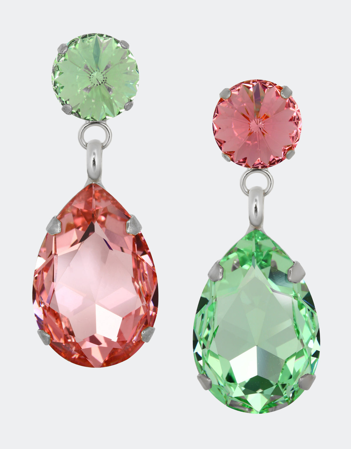 Selene Crystal Paradox Angelina earrings in green teardrop and pink round crystal with silver setting – opposing colour contrasts handcrafted into a striking drop earring design.