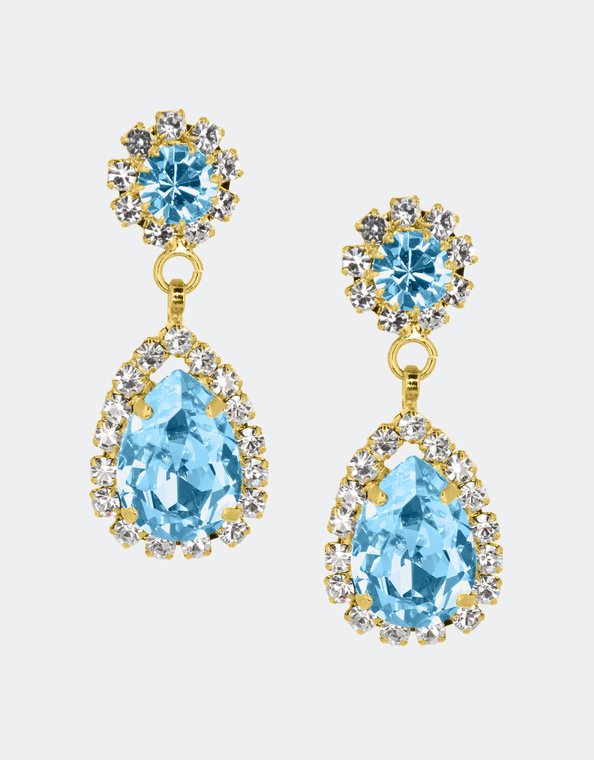 Selene Crystal Rosa drop earrings in aqua blue crystal with gold setting – fresh ocean-toned pear-shaped handcrafted earrings with striking sparkle for summer and occasion wear. Free worldwide shipping on orders over £199.