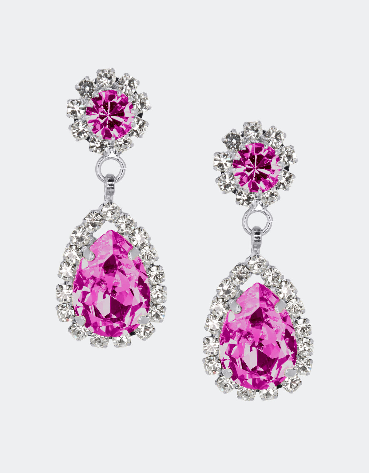 Selene Crystal Rosa drop earrings in fuchsia crystal with gold setting – rich jewel-toned pear-shaped handcrafted earrings with dramatic sparkle for evening and special occasions. Free worldwide shipping on orders over £199.