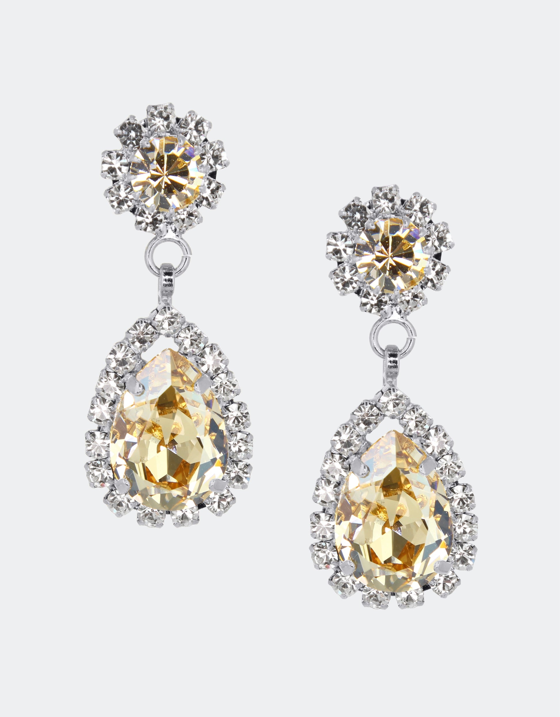 Selene Crystal Rosa drop earrings in teal crystal with gold setting – striking pear-shaped handcrafted jewellery with rich oceanic sparkle for parties and special occasions. Free worldwide shipping on orders over £199.